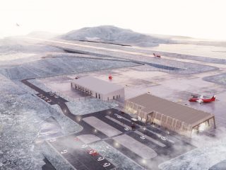 A snowy airport scene with planes on the tarmac, two modern buildings, a parking lot with cars, and a runway stretching into the distance toward misty mountains.