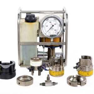 Tension Bolting Equipment with a large gauge, assorted metal fittings, couplings, connectors, and adapters arranged in front on a white background.